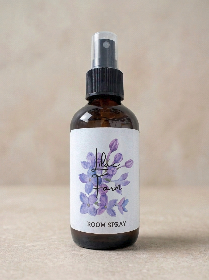 Room spray bottle with a label featuring purple flowers on a beige background